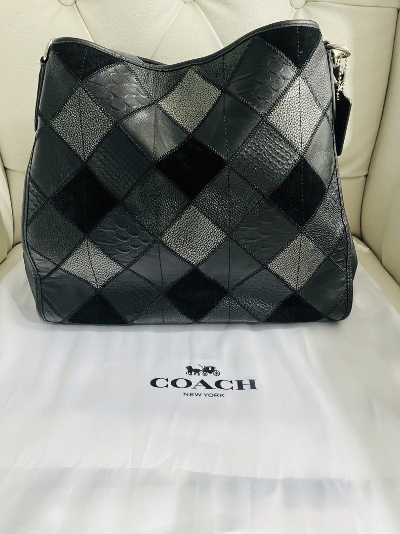 Coach New York Patchwork Leather Hobo Shoulder Bag Madison Phoebe (Category: Luxury Bags & Wallets) located in Mandaluyong City. Submitted by clairie03 (Listing ID 1462750325, Image 1). Description: - Authentic Coach New York Hobo Bag - Unique patchwork design with mixed leather textures and suede - Silver-tone hardware with Coach New York logo and horse and carriage emblem - Secure zipper closure - Comes with generic dust bag - Ideal for everyda