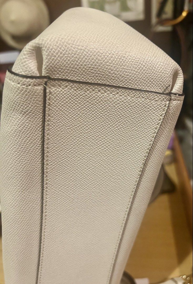 Coach Pebble Leather Satchel Bag (Category: Luxury Bags & Wallets) located in Quezon City. Submitted by asiaco (Listing ID 1462840093, Image 3). Description: Coach satchel bag, light cream pebble leather. Detachable crossbody strap, gold hardware. Includes care cards & tag. Perfect for daily use. Bought in Japan, hardly used. Flaw on creed. See pic. .