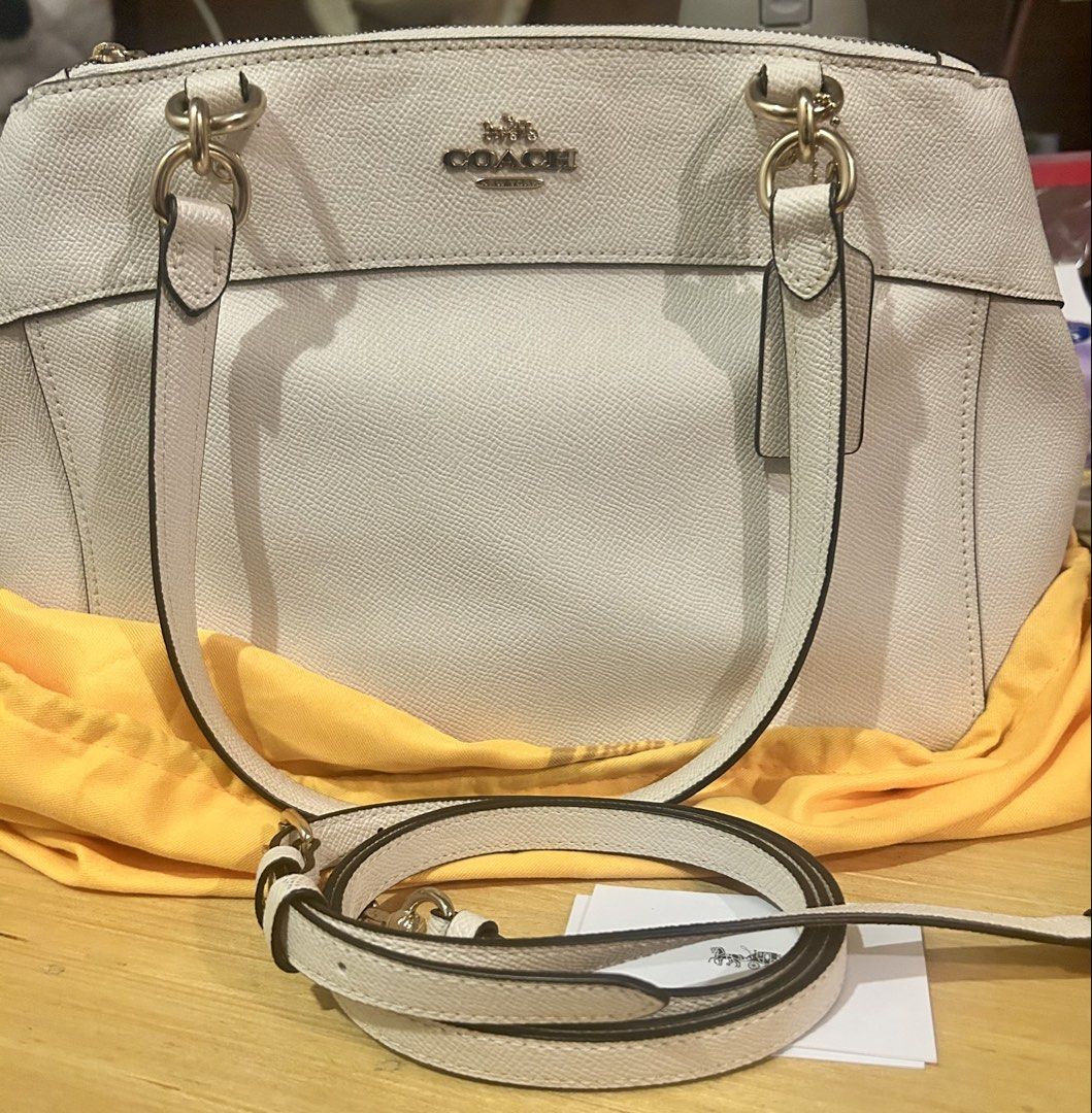 Coach Pebble Leather Satchel Bag (Category: Luxury Bags & Wallets) located in Quezon City. Submitted by asiaco (Listing ID 1462840093, Image 1). Description: Coach satchel bag, light cream pebble leather. Detachable crossbody strap, gold hardware. Includes care cards & tag. Perfect for daily use. Bought in Japan, hardly used. Flaw on creed. See pic. .
