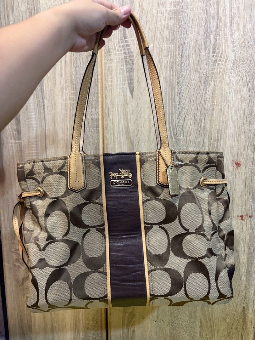 Coach Signature C Monogram Tote Bag (Category: Luxury Bags & Wallets) located in Manila. Submitted by cb_curations (Listing ID 1462849187, Image 1). Description: - Classic Coach tote bag - Signature C monogram canvas with leather trim - Gold hardware - Coach horse and carriage logo - Interior zip pocket and compartments - Spacious for essentials - Great for everyday use.