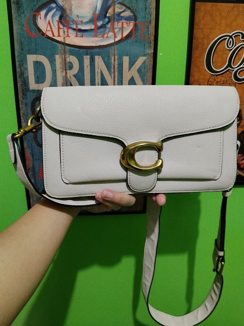 Coach Tabby Shoulder Bag 26 in Light Grey (Category: Luxury Bags & Wallets) located in Manila. Submitted by niklaus_12345 (Listing ID 1462840849, Image 1). Description: - Coach Tabby Shoulder Bag - Color: Light Grey - Material: Pebbled Leather - Hardware: Gold-tone with signature C clasp - Strap: Adjustable - Condition: Clean inside and out, ready for a new owner - Versatile: Ideal for everyday wear or evening events.