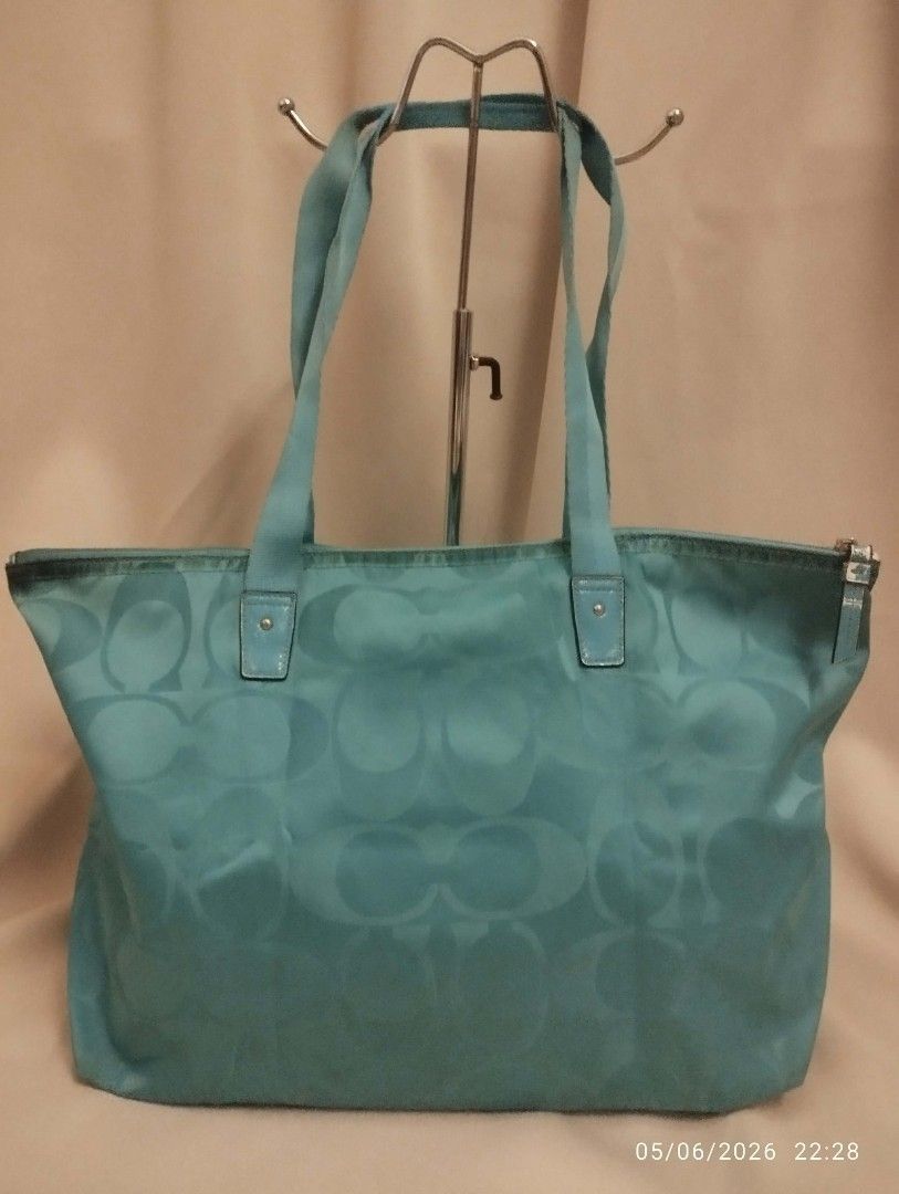 Coach weekender tote (Category: Tote Bags) located in Legazpi City. Submitted by coolfalcon_52838b (Listing ID 1462769157, Image 2). Description: signs of wear original coach bought it from USA missing pouch color is turquoise no runs no butas big compartment can fit 2 days set of clothes and essentials ykk zipper loc Albay JNT courier only.