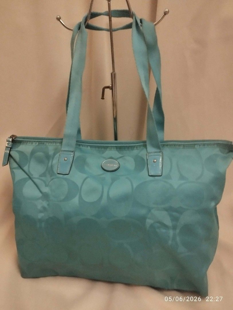 Coach weekender tote (Category: Tote Bags) located in Legazpi City. Submitted by coolfalcon_52838b (Listing ID 1462769157, Image 1). Description: signs of wear original coach bought it from USA missing pouch color is turquoise no runs no butas big compartment can fit 2 days set of clothes and essentials ykk zipper loc Albay JNT courier only.