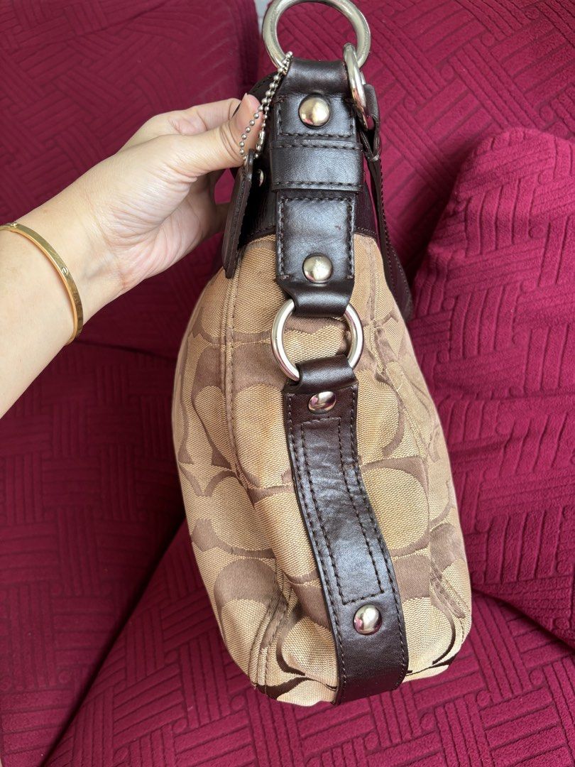 RUSH SALE Coach Zoe Large (Category: Luxury Bags & Wallets) located in Batangas. Submitted by missraee (Listing ID 1462710251, Image 3). Description: - Classic Coach hobo bag - Signature monogram canvas with dark brown leather trim - Light purple interior lining - Spacious main compartment - Silver hardware details maganda and malinis pa with extra sling. large size, ideal for everyday use. RANK AB Flaw: last photo, small tear lang sa side .