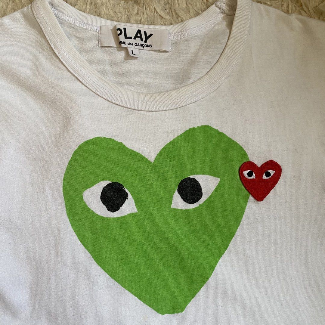 Comme Des Garcons Play White (Category: Shirts) located in Cebu City. Submitted by stevenkylegil (Listing ID 1462760979, Image 2). Description: Comme Des Garcons Play White Dimension: 18 width / 23.5 length Color rate: 10/10 Excellent condition - No issue Message me📩.