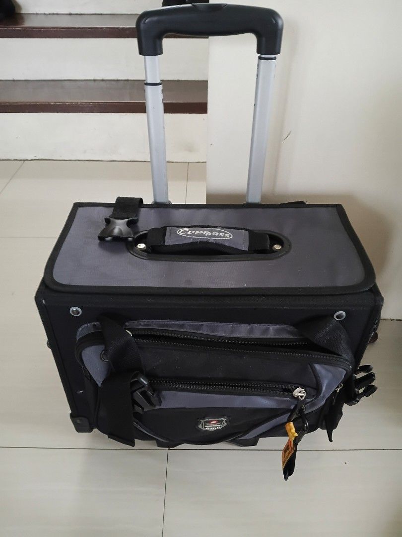 Compass Rolling Luggage Bag (Category: Luggage) located in Binan City. Submitted by jrmangge (Listing ID 1462781665, Image 1). Description: - Durable rolling luggage bag - Retractable handle and wheels for easy transport - Multiple compartments and pockets for organization - Great for all your travel needs.