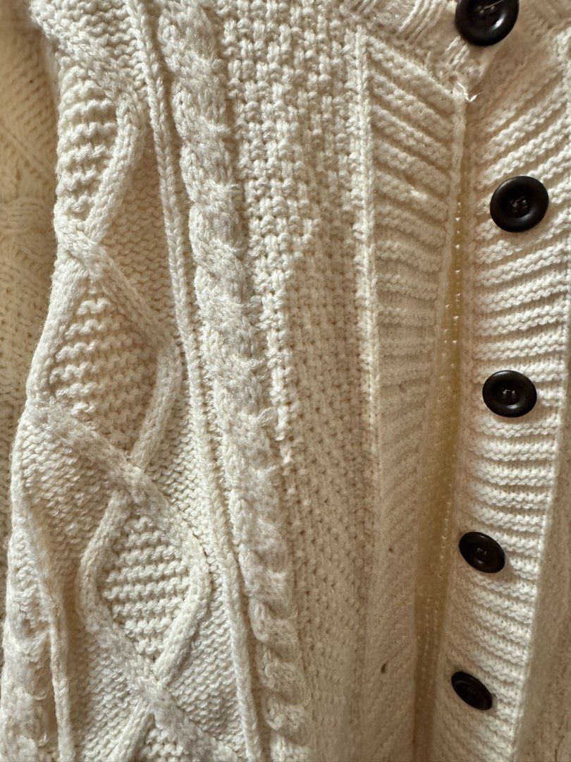 Cream Cable Knit Button Up Cardigan (Category: Coats, Jackets and Outerwear) located in Manila. Submitted by aussiegirl2027 (Listing ID 1462873839, Image 2). Description: **Buy 2 get 1 free promo** - Cream cable knit cardigan - Classic all-over cable knit pattern - Dark brown button-down front - Cozy and warm feel - Ideal for layering -Best fits small to semi large.