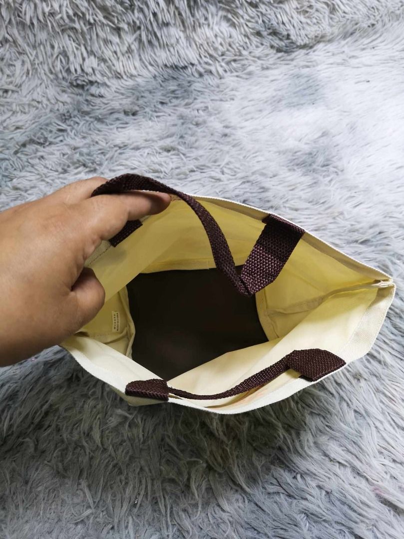 Cream Canvas Mini Tote bag With Brown Handle (Category: Tote Bags) located in Santa Cruz. Submitted by jmy_surplus.2 (Listing ID 1462686207, Image 2). Description: Size ; L- 7.4 W - 11 Color ; Cream Type ; Tote Bag Brand ; No brand Material ; Canvas Style ; Cream Mini Tote bag LR 129 JMY 5 Batch #222.