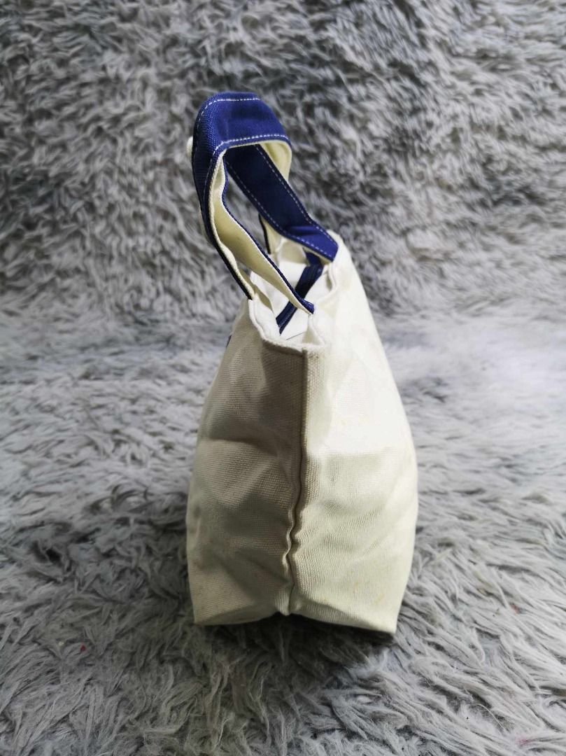 Cream Colored Canvas Mini Tote bag With Navy Blue Strap (Category: Tote Bags) located in Santa Cruz. Submitted by jmy_surplus.2 (Listing ID 1462791894, Image 2). Description: Size ; L - 7 W - 12 Color ; Cream Type ; Hand bag Brand ; No brand Material ; Canvas Style ; Canvas Mini Hand bag LR 129 JMY 5 Batch #222.