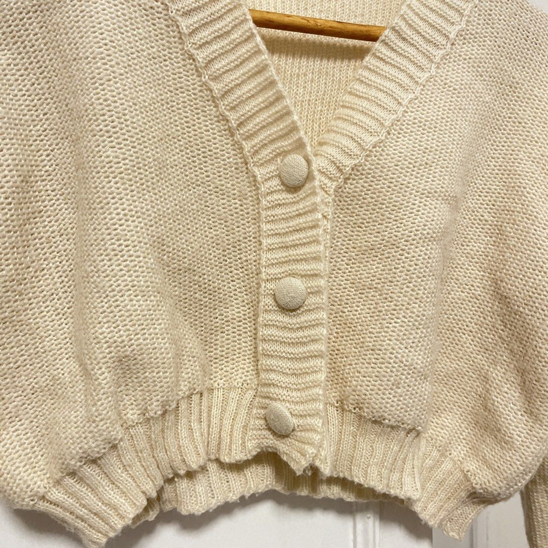 Cream Cropped Knit Cardigan (Category: Coats, Jackets and Outerwear) located in Las Pinas. Submitted by thevallerys (Listing ID 1462825025, Image 2). Description: - Fits XS-S - Cream knit cardigan - Cropped style - Button front closure - Ribbed cuffs and hem - Super cozy and warm - Ideal for layering over tops or dresses - Versatile for dressing up or down.