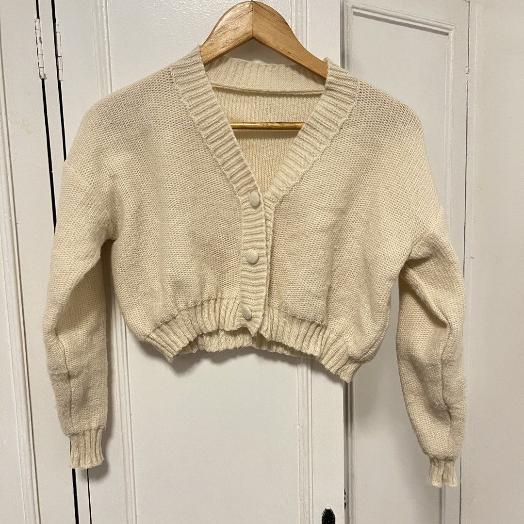 Cream Cropped Knit Cardigan (Category: Coats, Jackets and Outerwear) located in Las Pinas. Submitted by thevallerys (Listing ID 1462825025, Image 1). Description: - Fits XS-S - Cream knit cardigan - Cropped style - Button front closure - Ribbed cuffs and hem - Super cozy and warm - Ideal for layering over tops or dresses - Versatile for dressing up or down.