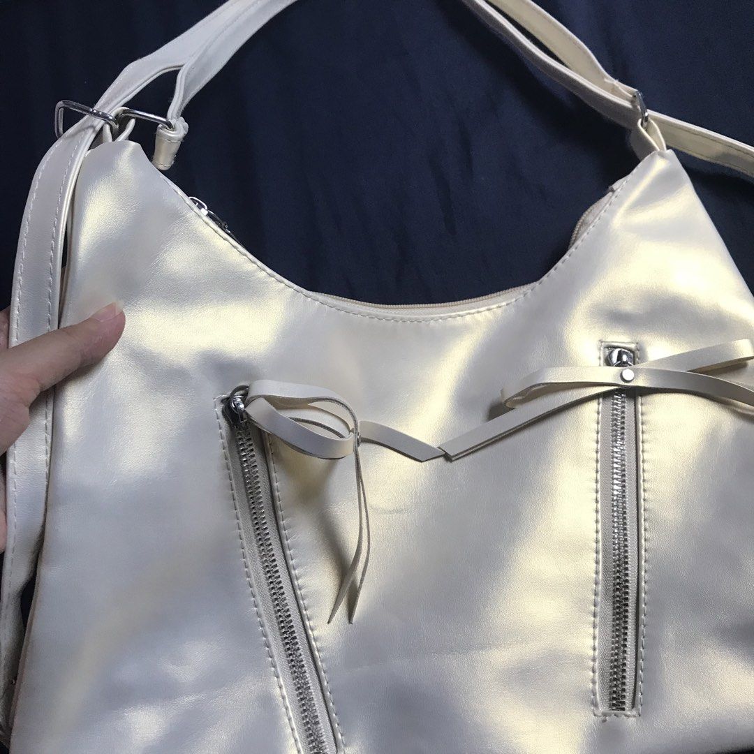 Cream Holo Sling Bag (Category: Shoulder Bags) located in Marikina City. Submitted by altvxz (Listing ID 1462726311, Image 2). Description: Can also be used as a backpack No flaws.
