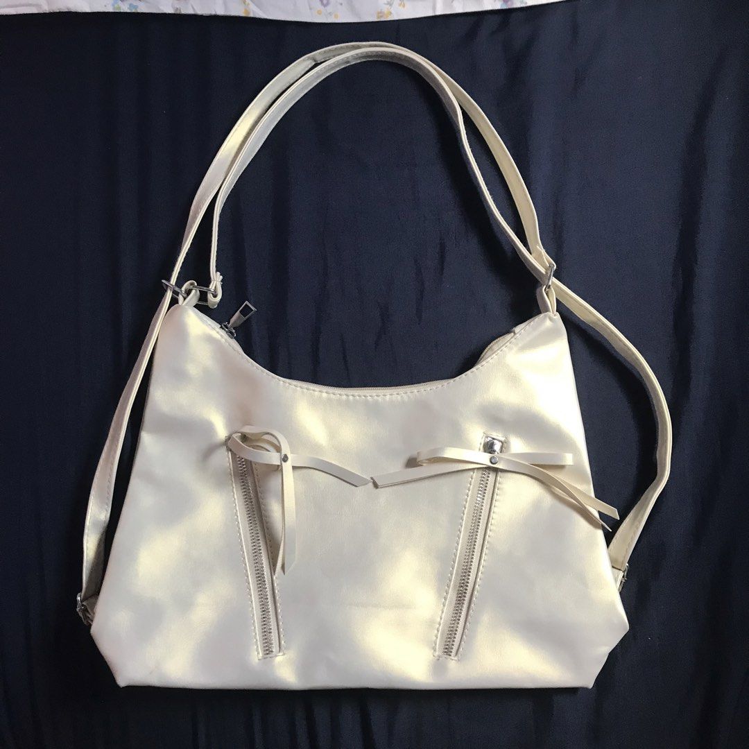 Cream Holo Sling Bag (Category: Shoulder Bags) located in Marikina City. Submitted by altvxz (Listing ID 1462726311, Image 1). Description: Can also be used as a backpack No flaws.