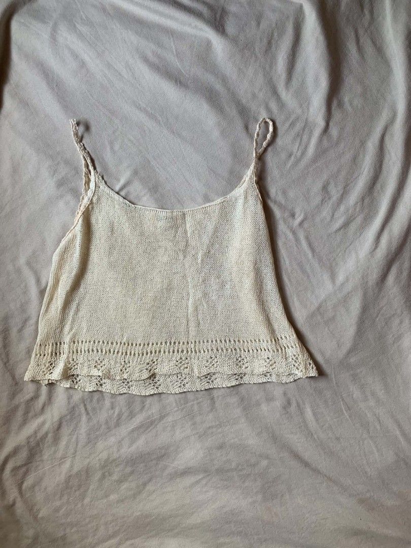 Cream Knit Tank cover up top (Category: Sleeveless) located in Cebu City. Submitted by book_bird (Listing ID 1462764610, Image 1). Description: - Cream knit tank top - Thin straps - Pretty crochet trim along the hem - Slightly sheer knit - Ideal for layering or wearing solo - Best fits size Small or Medium - Perfect for a beachy or bohemian aesthetic.