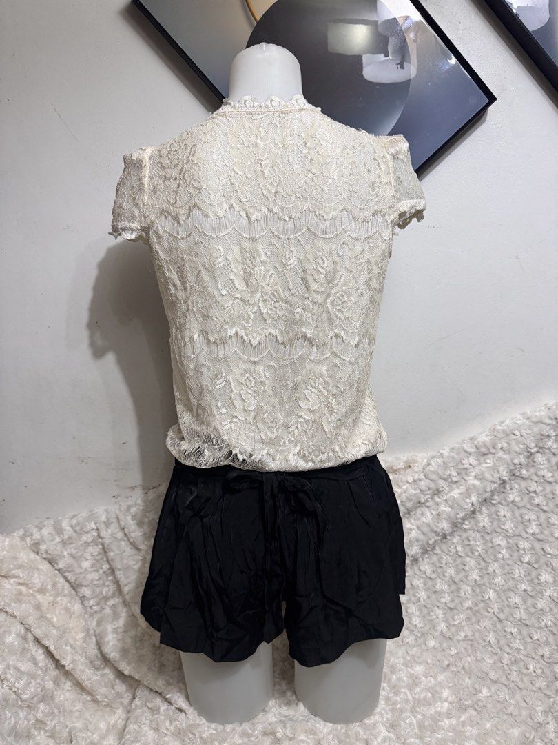 Cream Lace Button-Up Short Sleeve Top (Category: Blouses) located in Marikina City. Submitted by lorradel (Listing ID 1462727509, Image 3). Description: - Cream lace top - Short sleeves - Button-up front - Ruffled neckline - Delicate floral lace pattern - Pairs well with shorts or skirts - Suitable for casual or dressy occasions - MAY HAVE some washable stains (hindi maiiwasan) needs washing; had been stored - mannequin size 34-26-34 - mannequin’