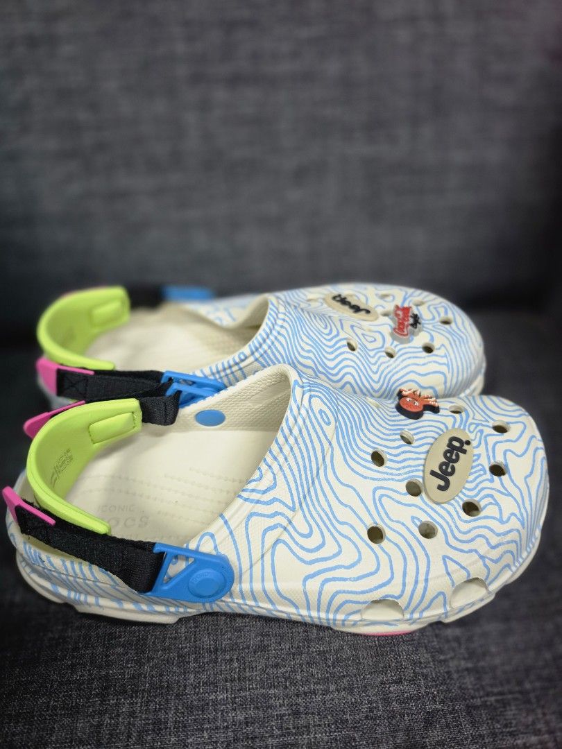 Crocs x Jeep x Coca-Cola Light Clogs (Category: Slippers & Slides) located in General Trias. Submitted by roselle2230 (Listing ID 1462831910, Image 3). Description: - Limited edition Crocs collaboration - Unique topographic map design - Includes Jeep and Coca-Cola Jibbitz - Bright neon accents on the heel strap - Super comfortable for everyday wear - Perfect as a statement piece.