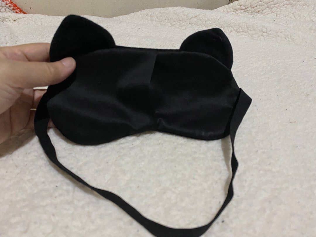 Cute Black Cat Plush Eye Mask for Sleep (Category: Sunglasses & Eyewear) located in Manila. Submitted by resi.diaz (Listing ID 1462874193, Image 3). Description: - Adorable black plush eye mask with a cute cat face design. - Features charming big white eyes and little ears. - Equipped with an elastic strap for a secure and comfortable fit. - Ideal for blocking out light for better sleep or during travel. - Made with soft material for ultimate com