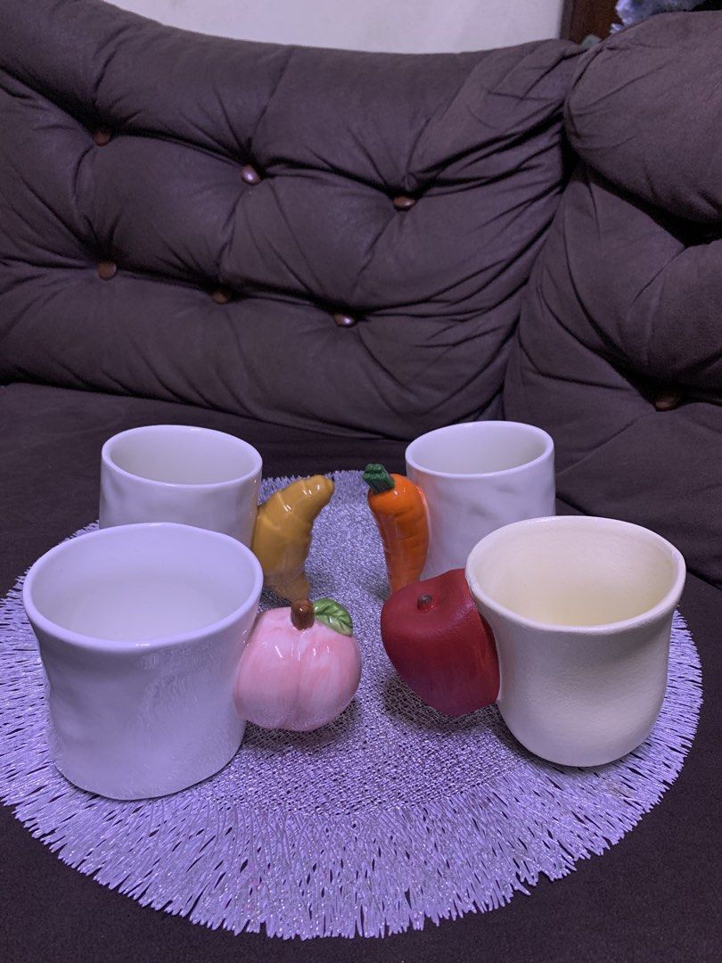 Cute Ceramic Mugs with Fruit and Pastry Handles (Category: Coffee & Tea Tableware) located in Cavite. Submitted by thinkerbelle_certified (Listing ID 1462718531, Image 2). Description: - Set of 4 ceramic mugs - Each mug features a unique handle shaped like a fruit or pastry - Includes: peach, apple, croissant, and carrot designs - White mugs with colorful, playful handles - Ideal for coffee, tea, or hot chocolate - Adds a fun, decorative touch to