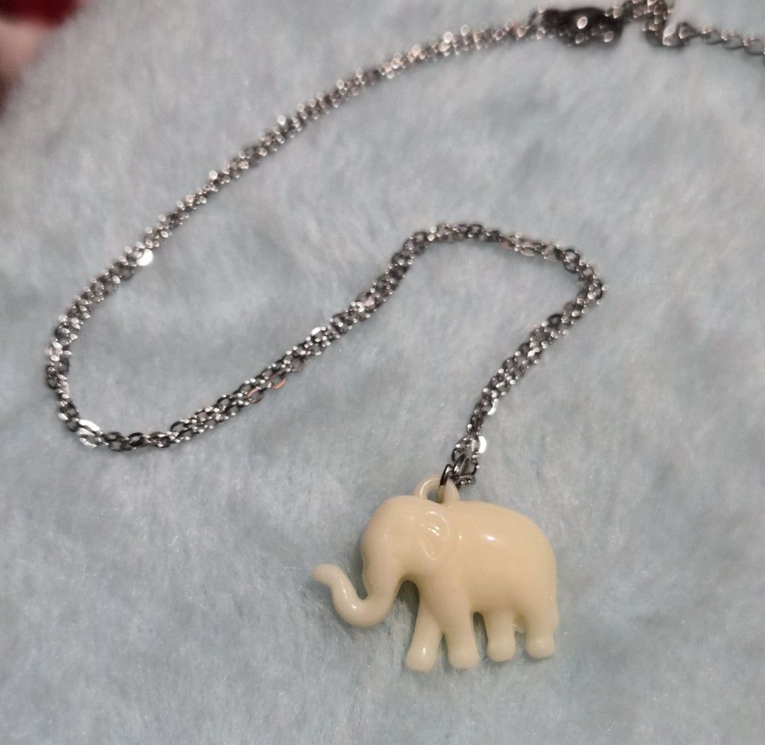 Cute Elephant Pendant Necklace (Category: Necklaces) located in Mandaue City. Submitted by chuchi152615 (Listing ID 1462826452, Image 1). Description: - Delicate silver chain necklace - Adorable cream-colored elephant charm - Small, rounded elephant pendant design - Adjustable clasp for a perfect fit - Ideal for everyday wear and adding personality to outfits.