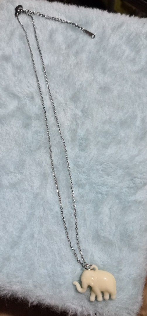 Cute Elephant Pendant Necklace (Category: Necklaces) located in Mandaue City. Submitted by chuchi152615 (Listing ID 1462826452, Image 3). Description: - Delicate silver chain necklace - Adorable cream-colored elephant charm - Small, rounded elephant pendant design - Adjustable clasp for a perfect fit - Ideal for everyday wear and adding personality to outfits.