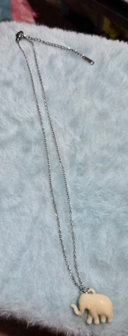 Cute Elephant Pendant Necklace (Category: Necklaces) located in Mandaue City. Submitted by chuchi152615 (Listing ID 1462826452, Image 2). Description: - Delicate silver chain necklace - Adorable cream-colored elephant charm - Small, rounded elephant pendant design - Adjustable clasp for a perfect fit - Ideal for everyday wear and adding personality to outfits.