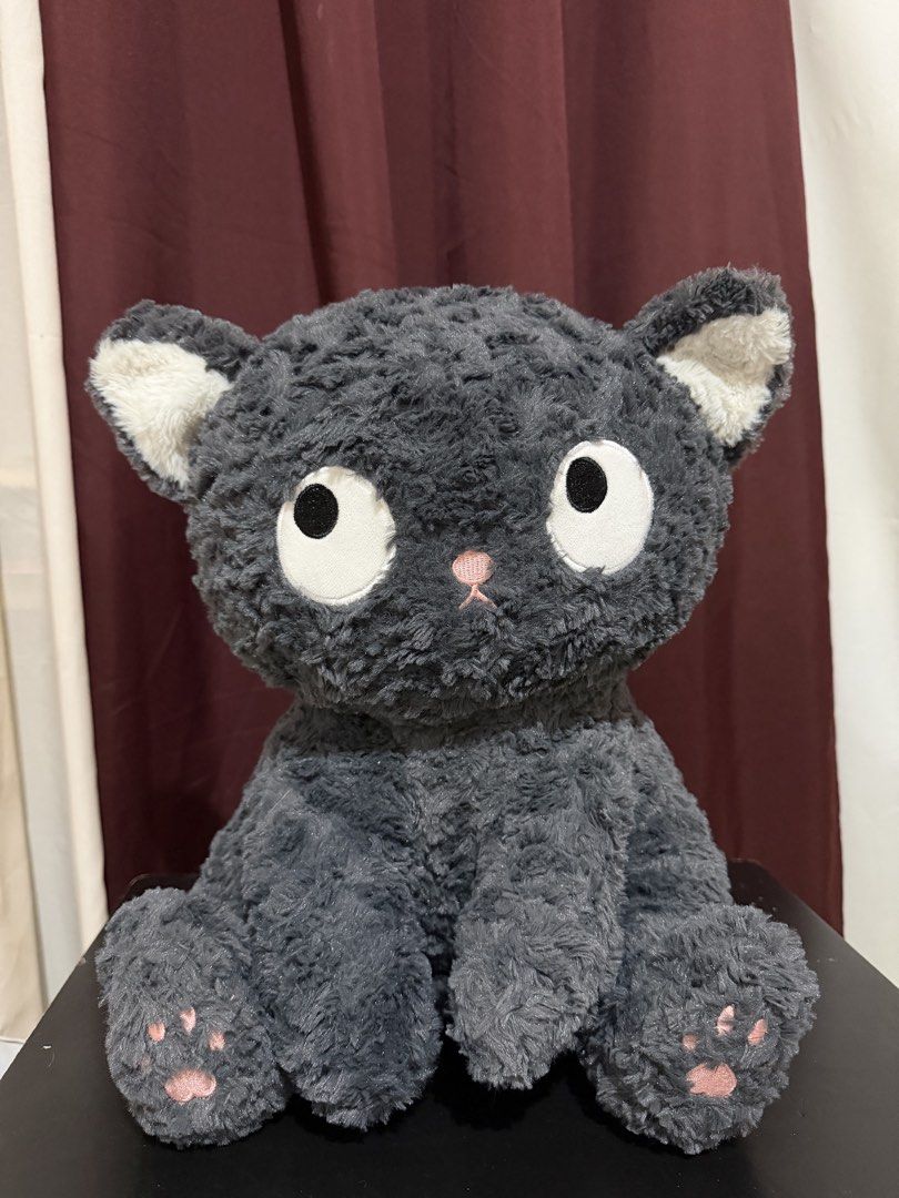 Cute Grey Cat Plush Toy (Category: Plushies & Soft Toys) located in Caloocan City. Submitted by rohllee (Listing ID 1462726405, Image 2). Description: - Super soft and fluffy grey cat plushie - Big, expressive eyes and pink paw pads - Approximately 10 inches tall - Perfect for cuddling or room decoration - Ideal gift for cat lovers of all ages.