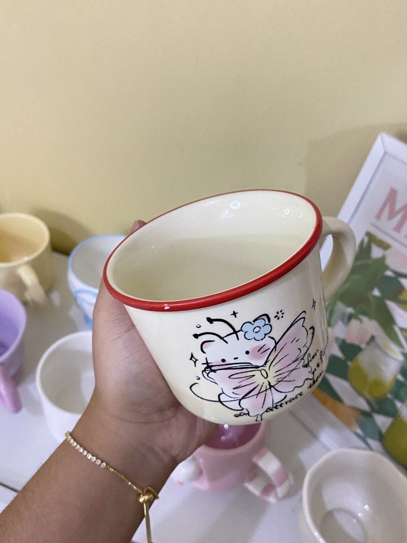 CUTE HELLO KITTY MUG (Category: Coffee & Tea Tableware) located in Dasmarinas. Submitted by hannah.oakph (Listing ID 1462765693, Image 2). Description: has paint chip in red rim.