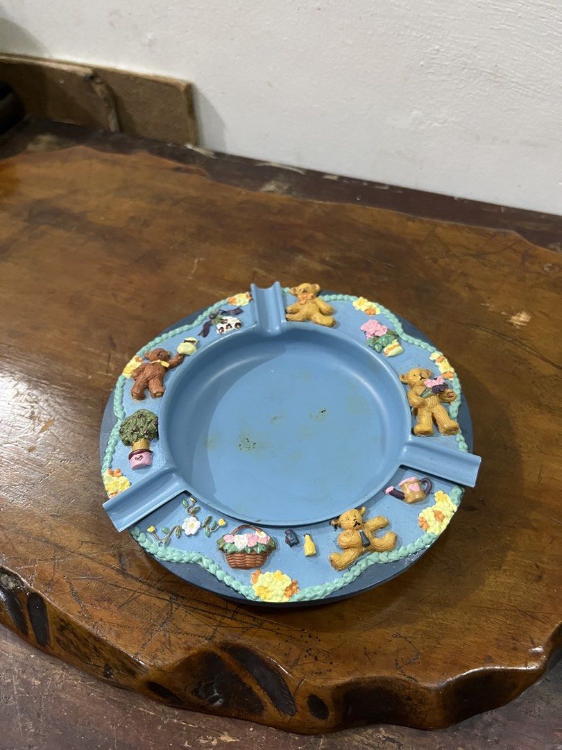 Cute Teddy Bear Ashtray Blue (Category: Other Home Decor) located in Taguig. Submitted by minmin_parker (Listing ID 1462834950, Image 1). Description: - Adorable blue ashtray featuring charming teddy bear designs. - Decorated with little bears, flowers, and a basket motif. - Perfect for collectors or as a unique decorative item. - Shows minor marks inside the tray..