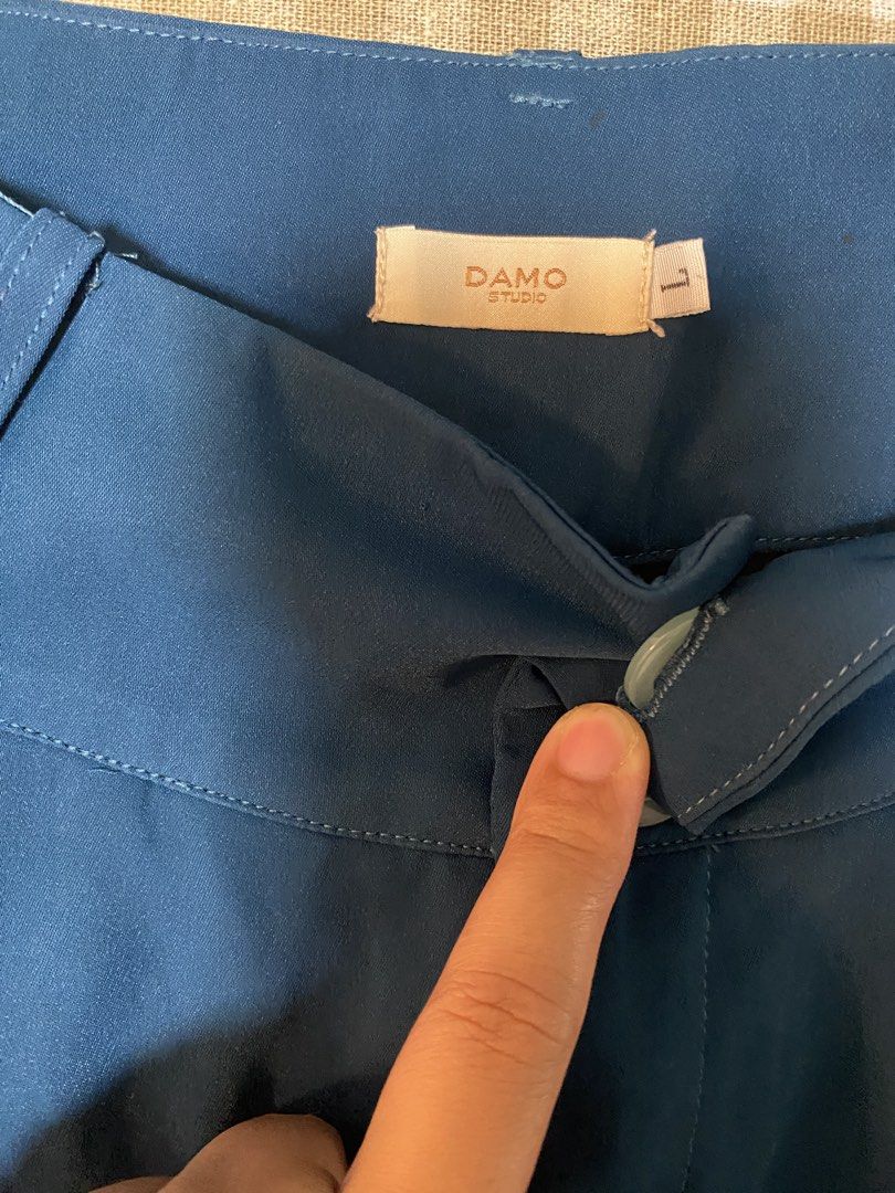 Damo Studio Blue Wide Leg Pants Size L (Category: Other Bottoms) located in Cavite. Submitted by yc.shoppemnl (Listing ID 1462786391, Image 2). Description: - Brand: Damo Studio - Color: Blue - Style: Wide leg pants - Waist: High waisted - Closure: Two-button - Detail: Pleated front - Size: L - Versatility: Perfect for dressing up or down.