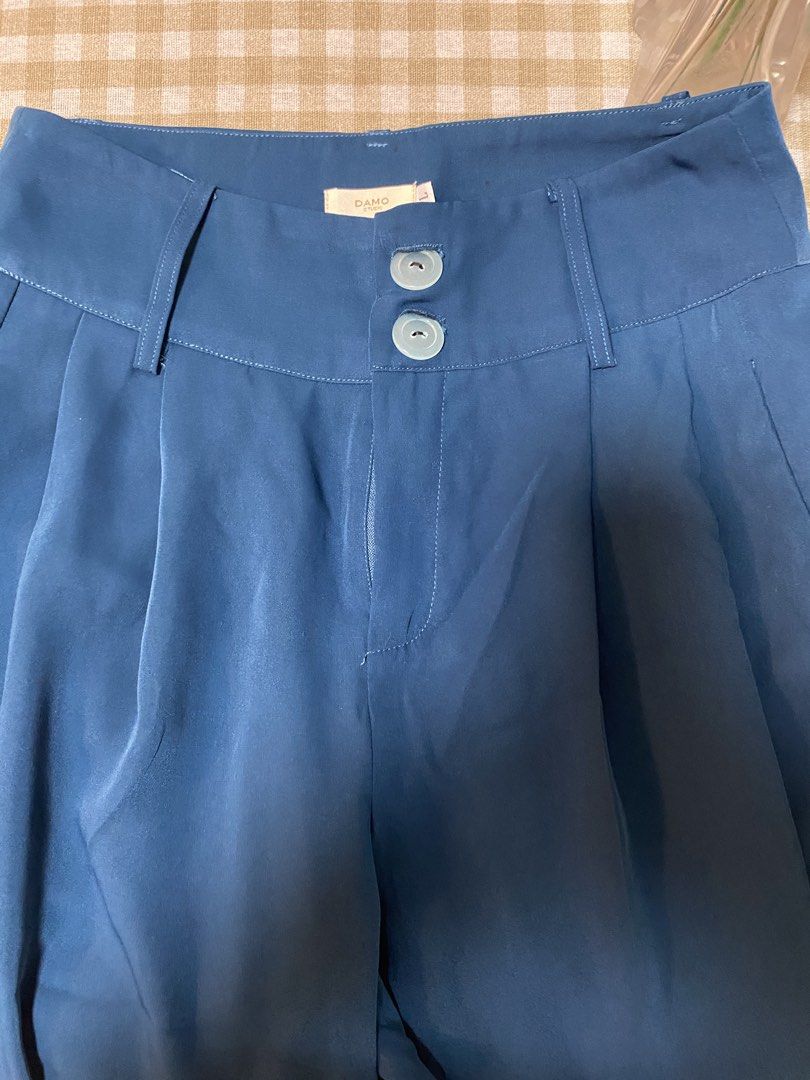 Damo Studio Blue Wide Leg Pants Size L (Category: Other Bottoms) located in Cavite. Submitted by yc.shoppemnl (Listing ID 1462786391, Image 3). Description: - Brand: Damo Studio - Color: Blue - Style: Wide leg pants - Waist: High waisted - Closure: Two-button - Detail: Pleated front - Size: L - Versatility: Perfect for dressing up or down.