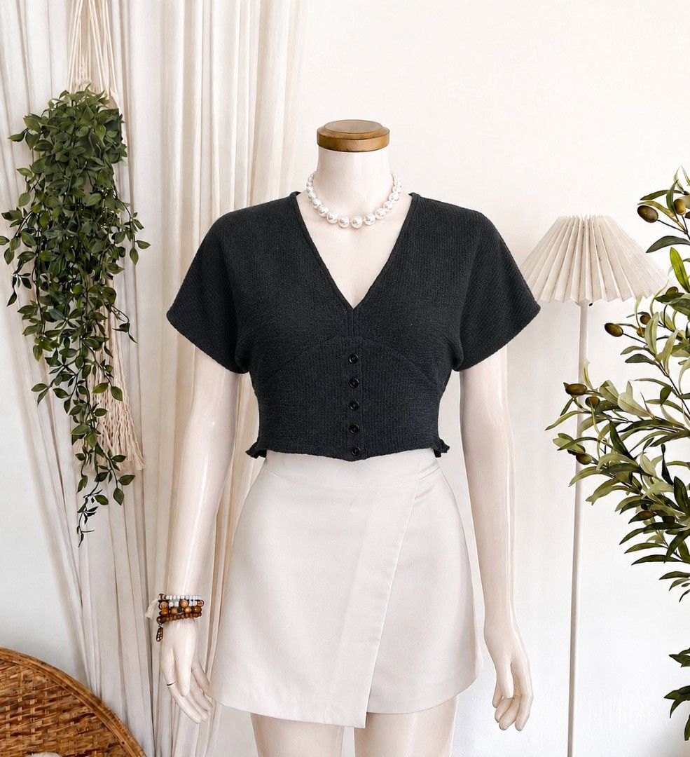 Dark Grey V-Neck Button-Up Cropped Knit Top (Category: Blouses) located in Cebu City. Submitted by smnthdanielle (Listing ID 1462882592, Image 1). Description: - Dark grey cropped knit top - V-neckline - Button-up front - Short, fluttery sleeves - Lettuce hem detail - Comfortable and stylish - Pairs well with high-waisted bottoms.