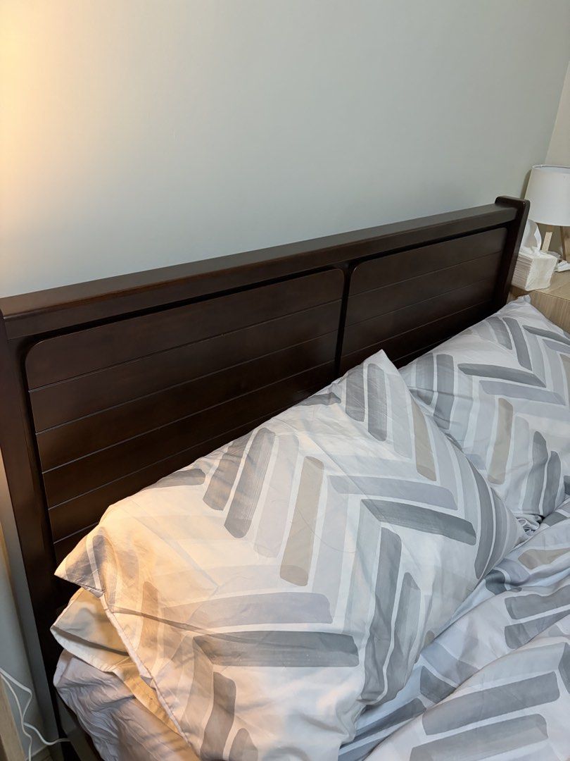 Dark Wood Full Double Size Bed Frame with Headboard (Category: Bed Frames & Mattresses) located in San Fernando. Submitted by maemandia (Listing ID 1462736756, Image 1). Description: - Solid dark wood bed frame - Full Double size - Wooden slatted headboard - Simple, modern design - Mattress and bedding not included.
