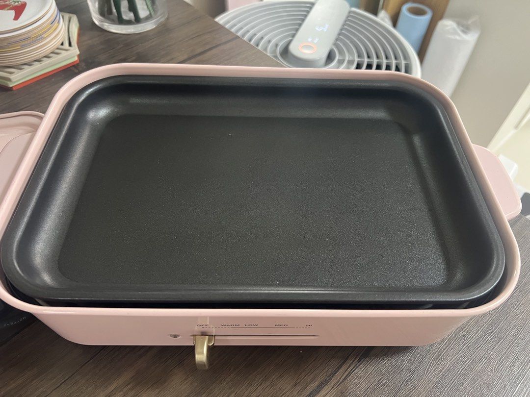 DASH Pink Electric Grill Pan (Category: Cookware & Accessories) located in Cainta. Submitted by hunchester (Listing ID 1462716065, Image 2). Description: - Pink DASH electric grill pan - Non-stick surface for easy cooking and cleaning - Adjustable temperature control (OFF to ) - Versatile for grilling, searing, and more - Includes power cord - Ideal for small gatherings or personal use.