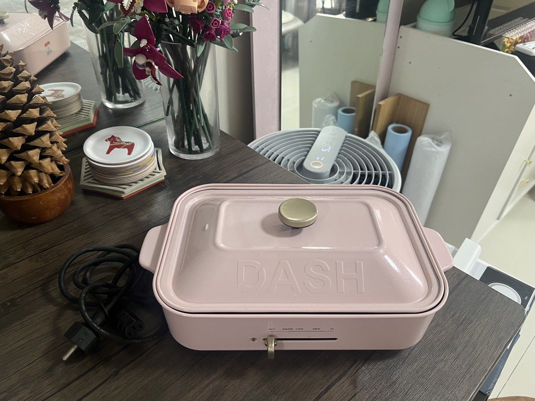 DASH Pink Electric Grill Pan (Category: Cookware & Accessories) located in Cainta. Submitted by hunchester (Listing ID 1462716065, Image 1). Description: - Pink DASH electric grill pan - Non-stick surface for easy cooking and cleaning - Adjustable temperature control (OFF to ) - Versatile for grilling, searing, and more - Includes power cord - Ideal for small gatherings or personal use.