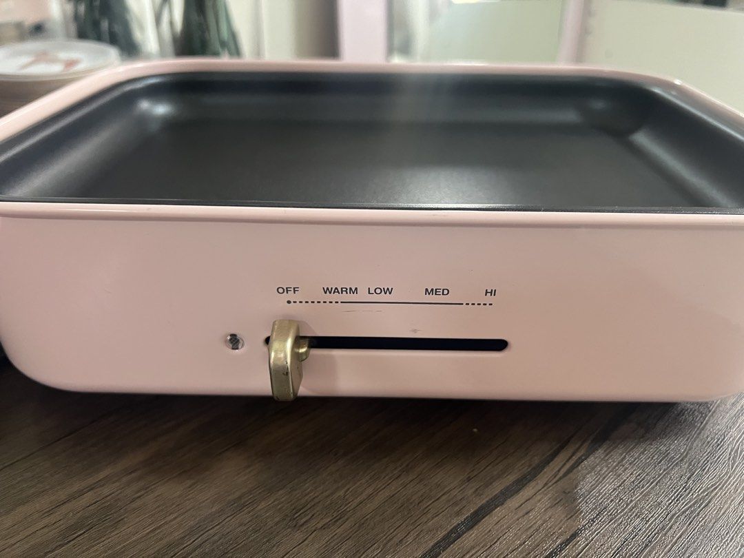 DASH Pink Electric Grill Pan (Category: Cookware & Accessories) located in Cainta. Submitted by hunchester (Listing ID 1462716065, Image 3). Description: - Pink DASH electric grill pan - Non-stick surface for easy cooking and cleaning - Adjustable temperature control (OFF to ) - Versatile for grilling, searing, and more - Includes power cord - Ideal for small gatherings or personal use.