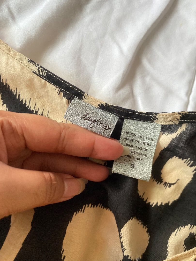 Daytrip 100% Cotton Leopard Print Top Size S (Category: Sleeveless) located in Laoag. Submitted by shop.kawes (Listing ID 1462688963, Image 2). Description: - Trendy leopard print Daytrip top - Made of comfortable 100% cotton - Size S - Care instructions available on the reverse #babydolltop #y2k.