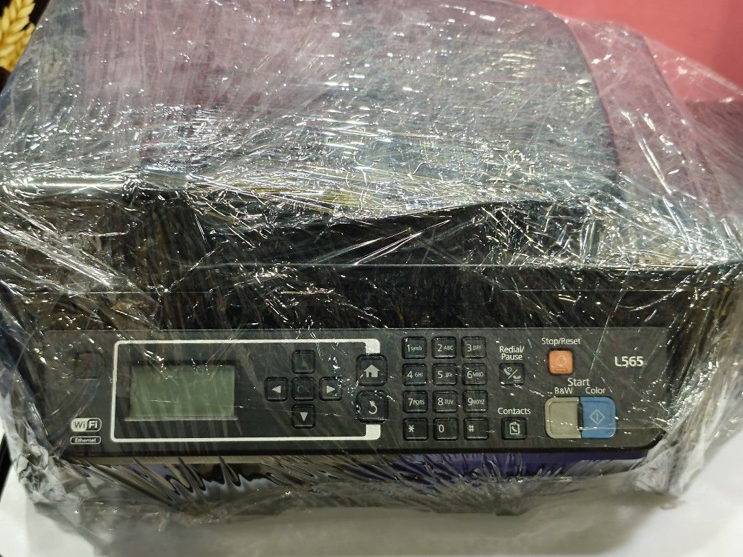 Defective Printer - Epson L565 (Category: Printers, Scanners & Copiers) located in Quezon City. Submitted by odiecs (Listing ID 1462852372, Image 3). Description: Defective Epson Printer Model: L565 Needs repair - With power, needs reset and replace rollers Body in good condition - no damage except the paper feeder but still can be used. Loc: Sauyo QC.