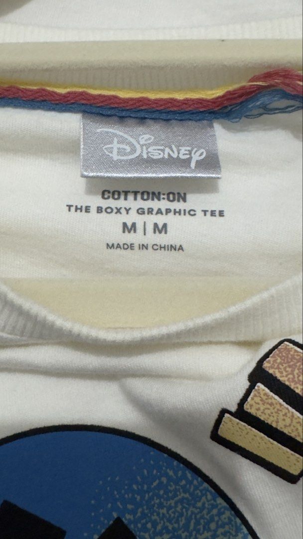 Disney Cotton On Mickey Mouse Graphic Tee (Category: Shirts) located in Quezon City. Submitted by heyhaveaniceday (Listing ID 1462844969, Image 2). Description: - Cotton On graphic tee - Features Mickey Mouse design - Includes Japanese text and mushroom graphics - Boxy fit, size Medium - Ideal for Disney enthusiasts - Made in China.