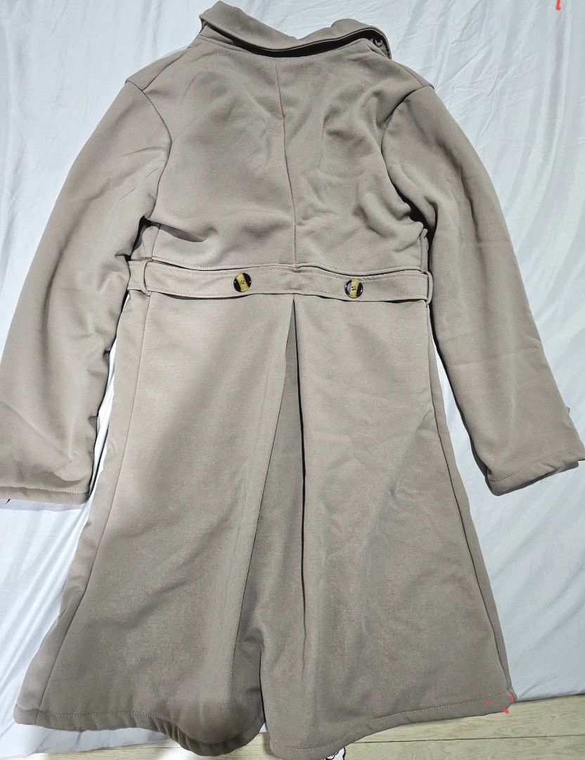 Double-breasted Trench Coat with Fur Lining (Category: Coats, Jackets and Outerwear) located in Manila. Submitted by kris.jul (Listing ID 1462838678, Image 2). Description: - Chic beige trench coat - Double-breasted design with elegant buttons - Cozy warm fur lining for extra comfort - Adjustable belted waist for a flattering fit - Button details on cuffs for a polished look - Ideal for cooler weather, keeping you stylish and warm.