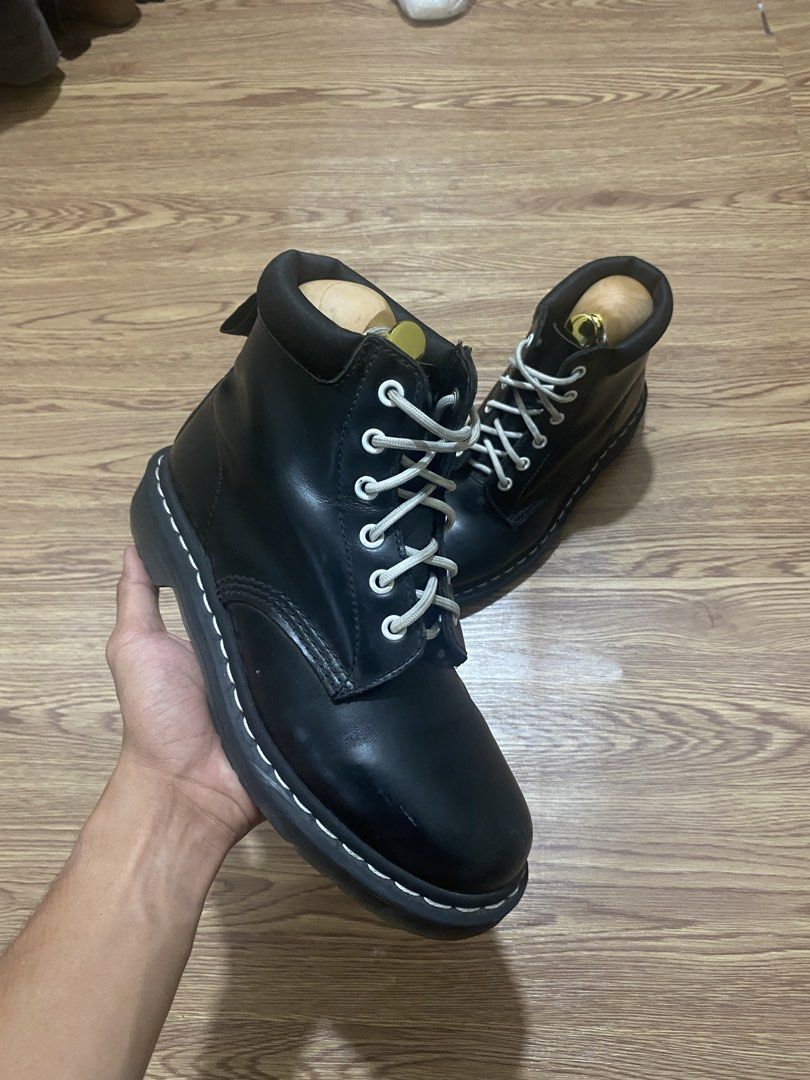 Dr. Martens Black Leather Lace-Up Boots (Category: Boots) located in Cebu City. Submitted by exeeell (Listing ID 1462858767, Image 3). Description: - Classic black Dr. Martens boots - Genuine leather construction - Signature white stitching detail - Durable, sturdy sole - Lace-up closure with white laces - Perfect staple for everyday wear - Pairs well with jeans, dresses, and more.