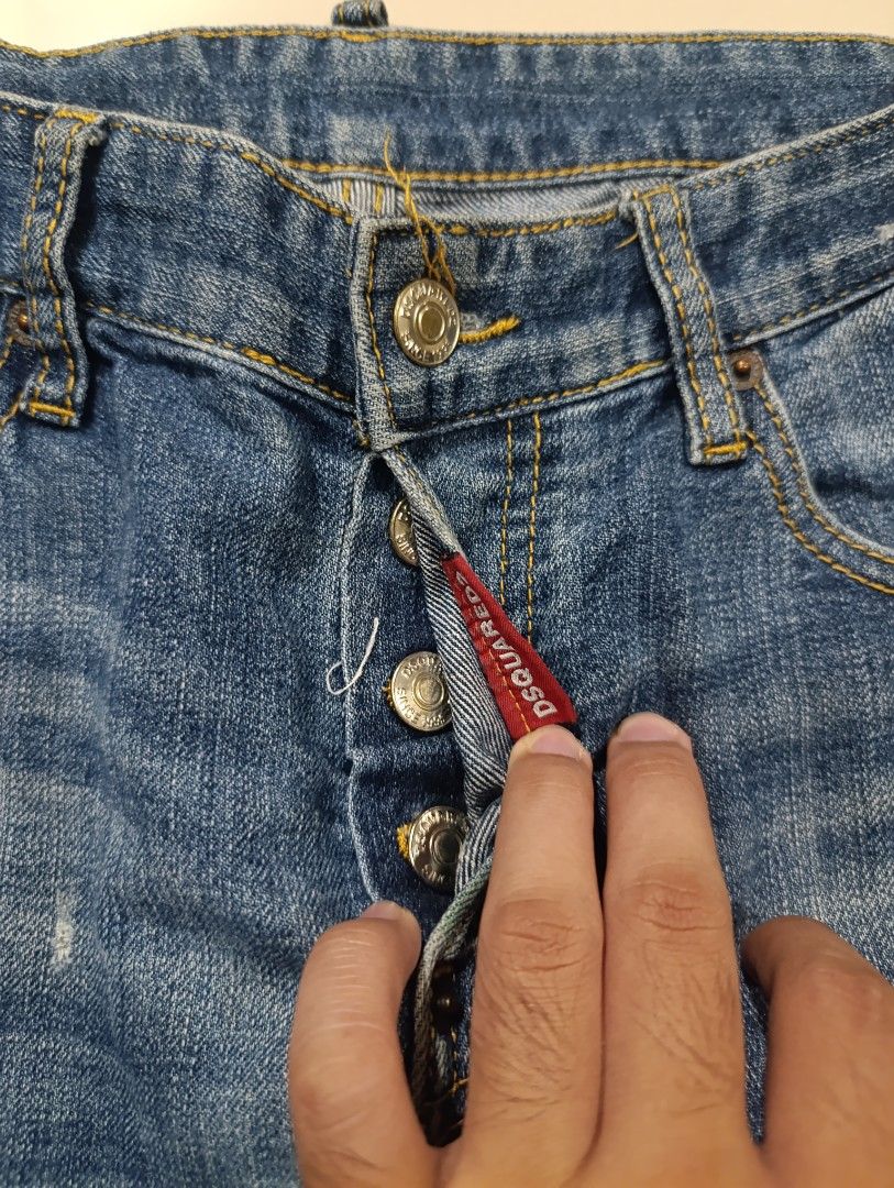 DSQUARED2 Distressed Wash Button Fly Jeans Size 46 (Category: Jeans) located in Davao. Submitted by idioticthrifter (Listing ID 1462869755, Image 2). Description: - Brand: DSQUARED2 - Size: 46 - Style: Distressed wash with paint splatters and ripped details - Closure: Button fly - Origin: Made in Italy - Key Feature: Statement piece for any denim collection - 31 waist, 37.5 length, 7 leg opening.