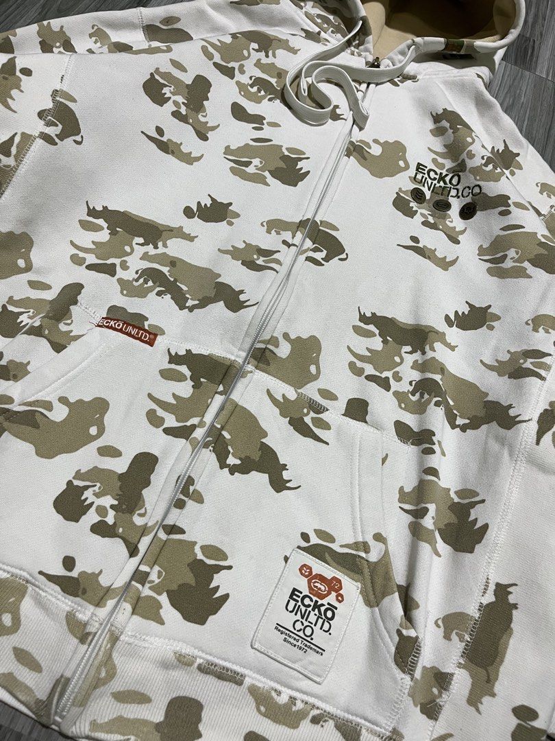 Ecko Unltd. Camo Zip-Up Hoodie (Category: Coats, Jackets and Outerwear) located in Cavite. Submitted by arespichri90266 (Listing ID 1462698787, Image 2). Description: Vintage ECKO UNLTD. CO AOP WITH METAL EMBLEM IN CHEST EXCELLENT CONDITION NO ISSUE 10/10 COLOR RATE DIMES: 24X27 .