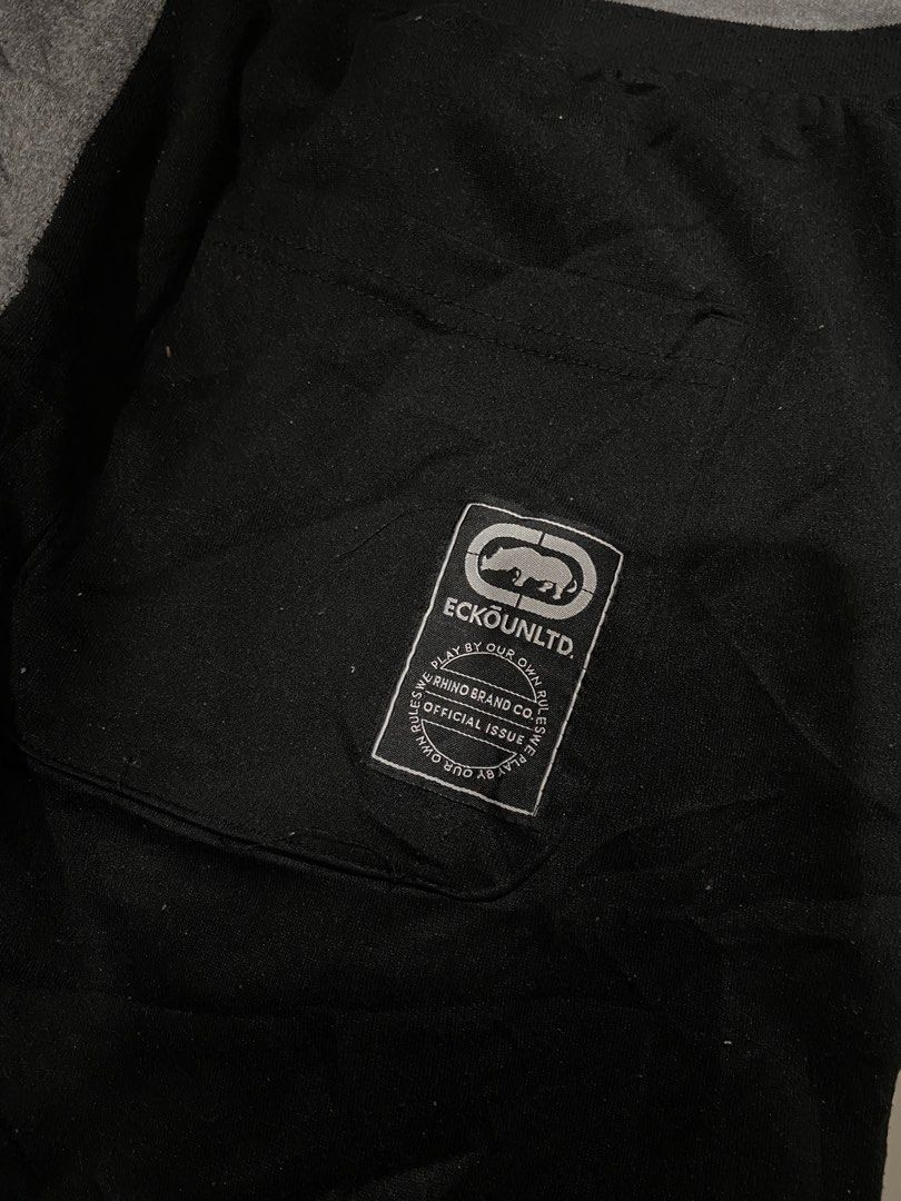 Ecko Unltd. Split Color Sweat Shorts XL (Category: Shorts) located in Cavite. Submitted by hail1530 (Listing ID 1462831798, Image 3). Description: - Ecko Unltd. shorts in XL size. - Stylish black and grey split design. - Features Ecko Unltd. logo on black side. - 'World Famous 1972' graphic on grey side. - Comfortable elastic waistband with drawstring. - Two convenient side pockets. - Ideal for everyday casual wear..