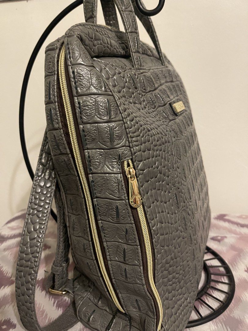 ELEQUATOR Grey Crocodile Embossed Backpack (Category: Backpacks) located in General Trias. Submitted by laconchita_tesoros (Listing ID 1462728176, Image 3). Description: - Stylish grey backpack with a sophisticated crocodile embossed texture. - Accented with elegant gold zippers and hardware. - Offers versatile carrying options with top handles and adjustable shoulder straps. - Spacious interior provides plenty of room for your essentials. - Idea