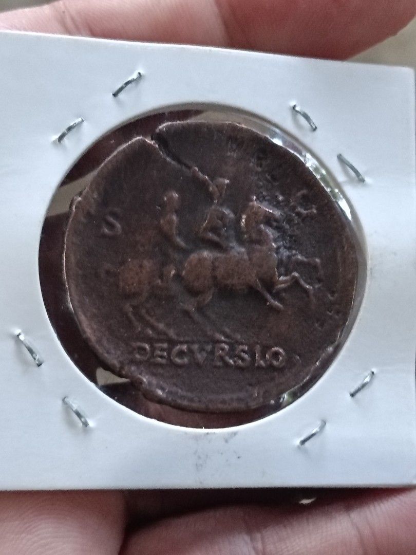 Emperor Nero Ancient Coin 54 AD (Category: Currency) located in Batangas. Submitted by swiftstone.96924b (Listing ID 1462781542, Image 2). Description: - ancient coin from Emperor Nero's reign - Dated approximately 54 AD - Features a profile of Emperor Nero on one side - Depicts a horse-riding figure on the other side - Shows visible wear consistent with its age - Unique piece for collectors.