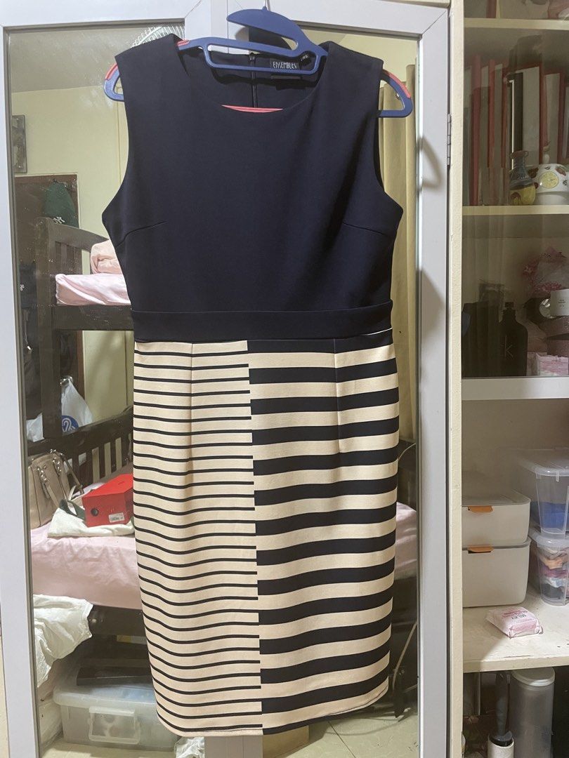 Ensembles sleeveless sheath dress (Category: Dresses) located in Rizal. Submitted by arlynazanion16 (Listing ID 1462720034, Image 1). Description: This is an Ensembles sleeveless sheath dress featuring a solid dark bodice paired with a uniquely split striped skirt..