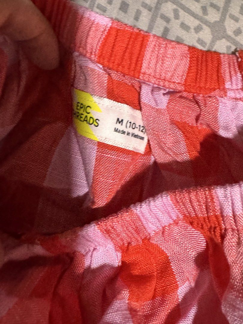 Epic Threads Red Pink Gingham Off Shoulder Top Size M (10-12) (Category: Blouses) located in Obando. Submitted by Wintermelonzzzz (Listing ID 1462781695, Image 2). Description: - Adorable off-shoulder design - Trendy red and pink gingham pattern - Flattering short flutter sleeves - Comfortable elasticated neckline and hem - Versatile for casual outfits - Proudly made in Vietnam.