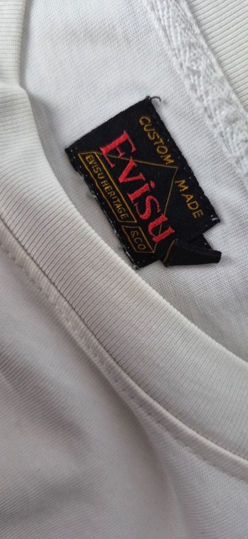 EVISU DENIM T-Shirt Graphic Print (Category: Tshirts & Polo Shirts ) located in Taguig. Submitted by regimennn (Listing ID 1462856624, Image 2). Description: Evisu Denim 1991 White Graphic Shirt Loose Fit. 20 x 24.