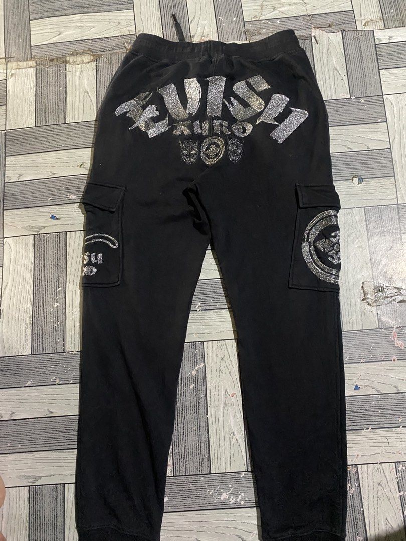 Evisu Kuro Cargo Pants (Category: Jeans) located in Bacolor. Submitted by paw_thrift (Listing ID 1462705767, Image 1). Description: - Black Evisu cargo pants - Glittery Evisu logo and Kuro text on the back - Evisu logo on side cargo pockets - Drawstring waist for adjustable comfort - Comfy and stylish design.