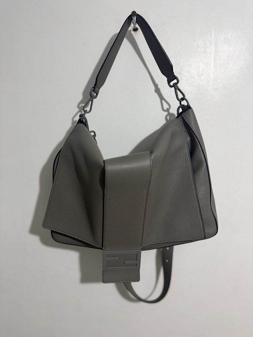 Fendi Baguette Messenger Bag (Category: Luxury Bags & Wallets) located in Davao. Submitted by goodstuff.149 (Listing ID 1462772719, Image 2). Description: Fendi Baguette Messenger Bag Gray Grained Leather Silver-Tone Hardware Flat Handle & Single Adjustable Shoulder Strap Single Exterior Pocket Suede Lining & Dual Interior Pockets Snap Closure at Front Inclusions: Dust bag, cards Condition: Near Unused Purchase History: Bought fr Japan Dimensions